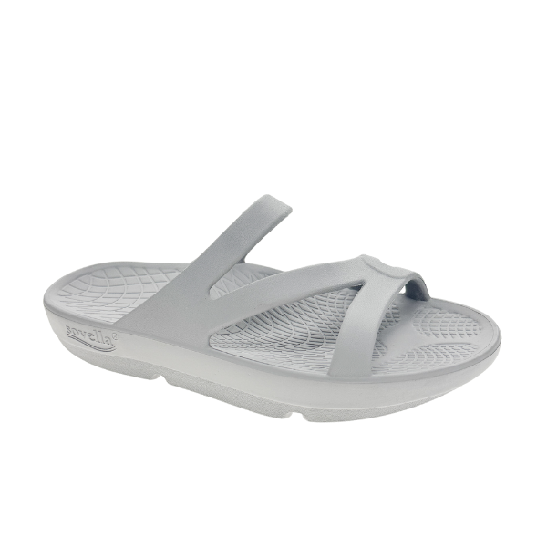 The Sovella Womens PF Slide Light Grey is a slip-on sandal with two angled straps, textured footbed, arch support, a slightly elevated sole, and SOVELLA branding on the side.