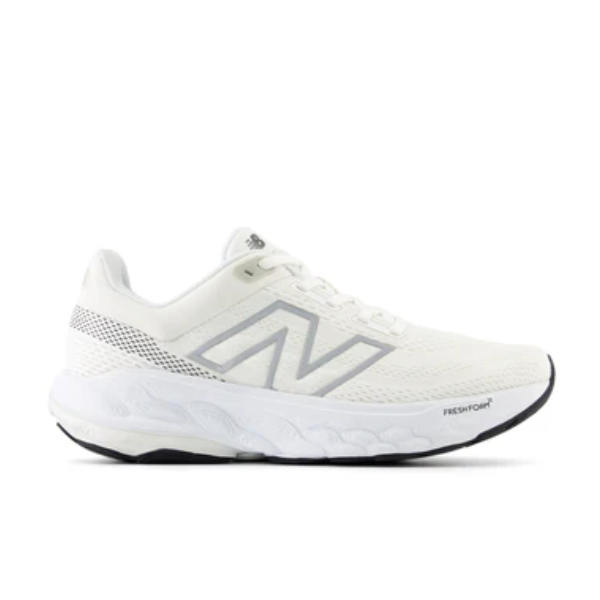 The New Balance Womens Fresh Foam 860v14 White features silver accents, a mesh upper, and a cushioned Fresh Foam X sole for comfort—ideal for stability seekers. Displayed in profile on a plain white background.