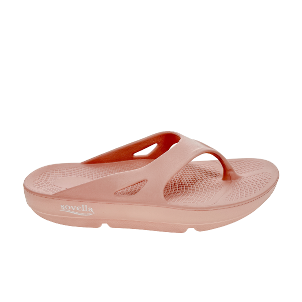 The Sovella Womens PF Thong Pink sandal features a thick sole, textured footbed, and arch support for comfortable recovery, shown in side profile against a white background.