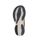 The image shows the sole of the New Balance Mens Fresh Foam X 1080v14 Wide Sea Salt, featuring a beige base with blue and black rubber grip patterns against a white background. This NEW BALANCE model highlights Fresh Foam X comfort technology.