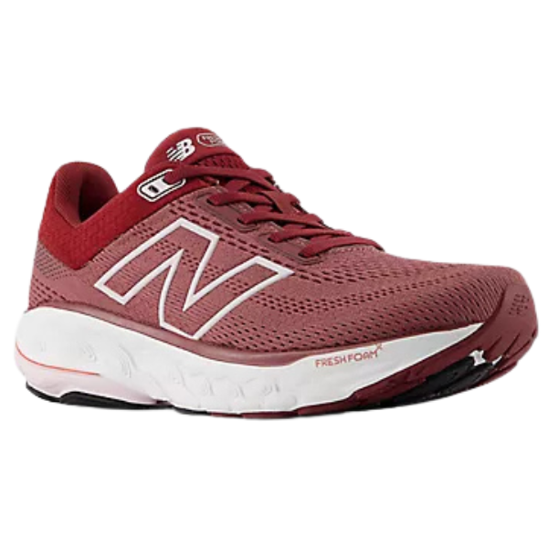 Red running shoe with white sole on a white background
