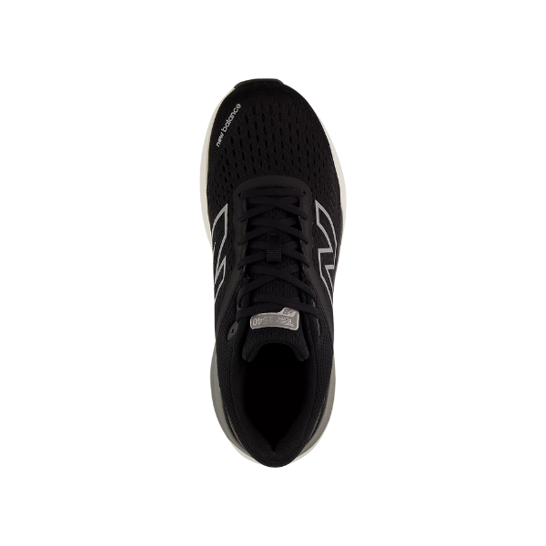 Top view of the New Balance Womens Fresh Foam X 1540v4 Wide Black/White shoe, featuring Fresh Foam X cushioning, black laces, a white midsole, and a dark mesh upper. Centered on a plain white background.