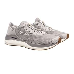 The OLUKAI Mens Ahi in Ash/Sterling are quick-drying athletic sneakers with mesh uppers, white laces, and white soles with brown accents, designed for barefoot comfort; shown angled from the side and above.
