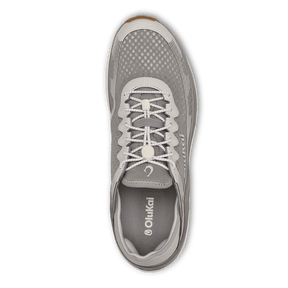Top view of the Olukai Mens Ahi Ash/Sterling by OLUKAI—a gray athletic shoe with white laces, mesh upper, and branded insole, designed for barefoot comfort and perfect as waterman footwear.
