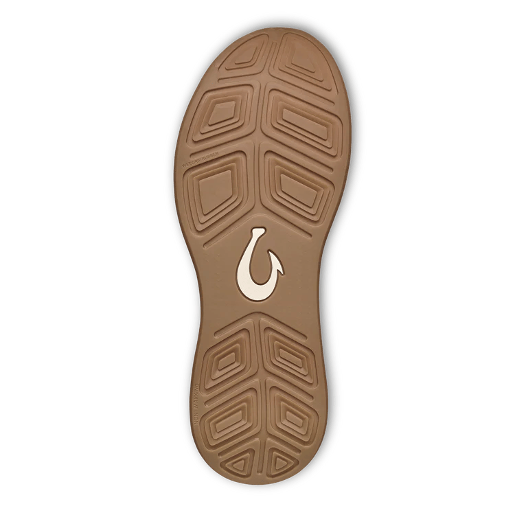 The OLUKAI Mens Ahi Ash/Sterling features a brown sole with textured patterns, a white hook-shaped logo, black edging, and geometric grooves for traction—designed for barefoot comfort and perfect for Waterman Footwear fans.