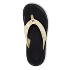 An OLUKAI Womens Ohana Toasted Coconut sandal with a patterned strap and dark, water-resistant anatomical footbed is shown from above on a plain white background.