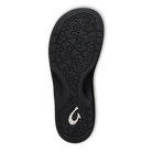 The Olukai Womens Ohana Toasted Coconut sandal features a black sole with a swirly texture, OLUKAI’s white wave-like logo near the heel, an anatomical footbed, and comes on a transparent background.