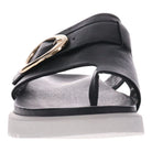 The Revere Womens Biscay Black sandal by REVERE features a Wide black strap, gold buckle, open toe, and white flat sole. Its simple, modern design delivers all-day comfort for women.