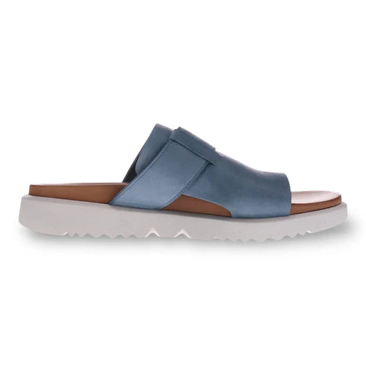 The REVERE Womens Biscay Blue is a premium leather slide sandal with an open toe, Wide strap, anatomical footbed, and thick white sole, displayed in a side profile on a plain white background.