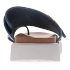 Rear view of the REVERE Womens Biscay Blue sandal shows its navy premium leather upper, tan anatomically designed footbed, and thick white sole with a supportive heel area.