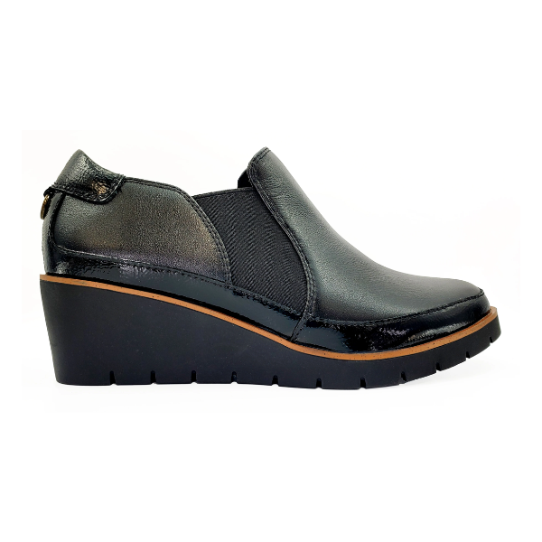 The REVERE Womens Mykonos Wedge Loafer Black features a textured finish, elastic side panels, and thick rubber sole—perfect arch support loafers for travel, shown on a white background.