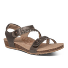 The Aetrex Womens Jillian Bronze sandal features brown open-toe design, braided and smooth straps with metal accents, a low wedge heel, cork-textured sole, and plush memory foam cushioning for all-day comfort.
