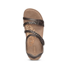 The Aetrex Womens Jillian Bronze sandal features braided and smooth straps, a floral tan Lynco orthotic footbed, and a circular decorative emblem near the straps, displayed against a white background.