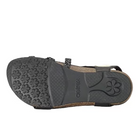 The image shows the bottom view of the Aetrex Womens Jillian Black sandal with a black rubber sole featuring floral patterns for traction and aetrex embossed in the center, plus an orthotic footbed, cork base, and black straps.