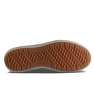 The image shows the sole of the Clarks Womens Nalle Lace Wide Black/White sneaker by CLARKS, with a light brown, textured rubber bottom featuring a diamond pattern and logo at the center. The sides of the sole are light beige.