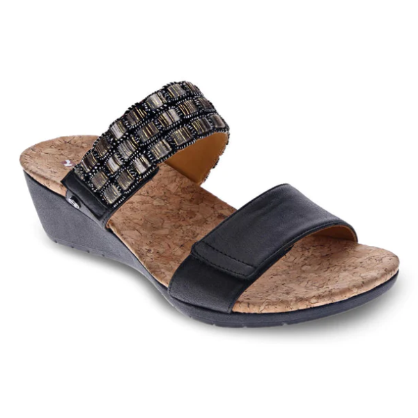The REVERE Revere Womens Sorrento Onyx is a black orthotic wedge sandal with a cork footbed, plain toe strap, and midfoot strap adorned with square beads for stylish foot pain relief.
