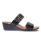 The Revere Womens Sorrento Onyx by REVERE is a black orthotic wedge sandal with a cork footbed, featuring a plain front strap and a beaded upper strap. The wedge sole offers slight heel elevation for comfort and foot pain relief.