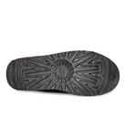 The image shows the black rubber sole of the UGG Mens Neuman Slipper, featuring a textured geometric tread and center circle design, crafted with Treadlite by UGG for lightweight comfort.