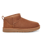 The UGG Womens Classic Ultra Mini Boot in Chestnut features brown suede, a flat rubber sole, visible stitching, a back pull tab, and plush lining for cozy comfort.