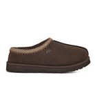 The UGG Mens Tasman Slippers Brown feature a brown suede slip-on upper, stitched patterned collar, side UGG logo, rounded toe, sheepskin lining, and a thick textured rubber sole.