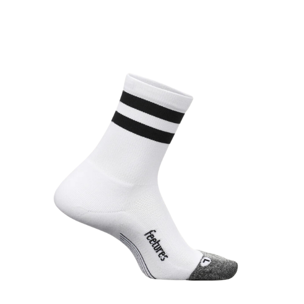 The FEETURES Unisex Elite Light Cushion Mini Crew White High Top Stripe sock features two black stripes near the top, a gray toe, light cushioning, and an anatomical design. Feetures is printed on the side and its shown angled against a white background.