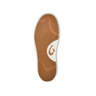 The image shows the sole of the OLUKAI Mens Lae‘ahi Lī ‘Ili Leather Sneaker in white, featuring a brown and white tread with wave-like curves and a stylized fishhook logo. The background is plain white.