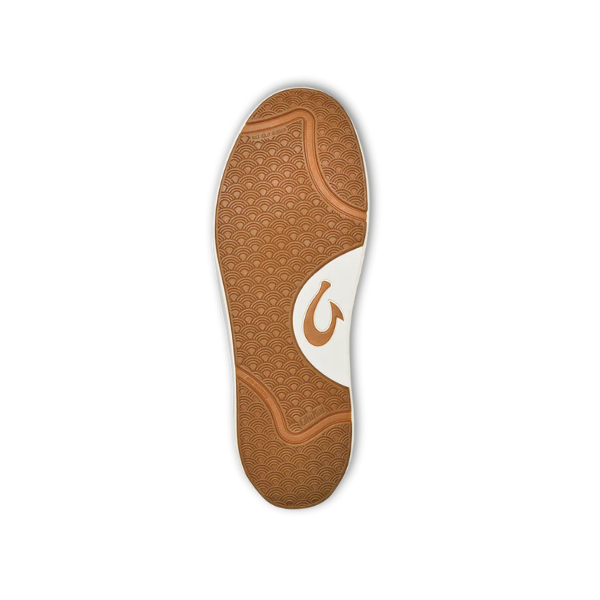 The image shows the sole of the OLUKAI Mens Lae‘ahi Lī ‘Ili Leather Sneaker in white, featuring a brown and white tread with wave-like curves and a stylized fishhook logo. The background is plain white.