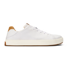 The OLUKAI Mens Lae‘ahi Lī ‘Ili Leather Sneaker in white features a white sole, laces, and tan accents on the heel and tongue, showcased on a plain white background.