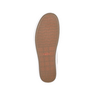 The image displays the sole of the Taos Womens Plim Soul Lux Silver shoe, featuring a tan rubber bottom designed for metatarsal support. The sole is embossed with taos and has a single red TAOS logo near the center.