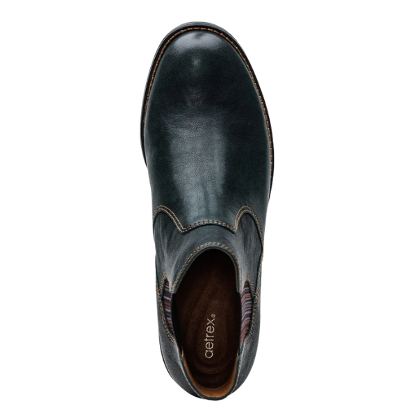 Top view of the Aetrex Women's Kaylee Green slip-on by AETREX WORLDWide INC, featuring dark leather, decorative stitching, a rounded toe, visible brown insole with arch support, and design detail near the opening.