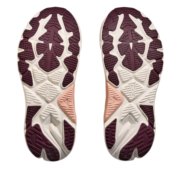 The image displays the soles of two HOKA Women's Arahi 8 Blush/Rose shoes side by side, featuring a geometric tread in deep burgundy, off-white, and tan—designed for stability and support for women with overpronation.
