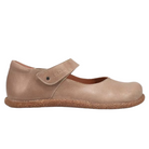 The Taos Women's Ultimate Leather Mary Jane Mushroom by TAOS offers orthotic-friendly comfort with a tan finish, rounded toe, single hook-and-loop strap, textured rubber sole, and built-in arch support for all-day wear.