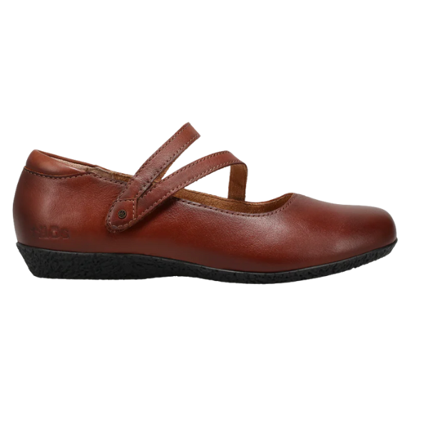 The TAOS Women's Banter Cognac is a brown leather Mary Jane flat with two diagonal straps, arch support for plantar fasciitis relief, and a black textured sole, shown in a side view.