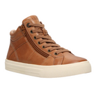 The Taos Women's Winner Caramel by TAOS is a brown high-top leather sneaker with tan laces, a side zipper, white rubber sole, and removable footbed. Shown at a three-quarter angle against a white background.