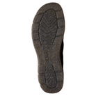 The image shows the bottom view of a CLARKS Women's Orlene Clog Black Combination Nubuck slip-on, highlighting its textured non-slip tread pattern and visible grooves for traction, photographed on a white background.