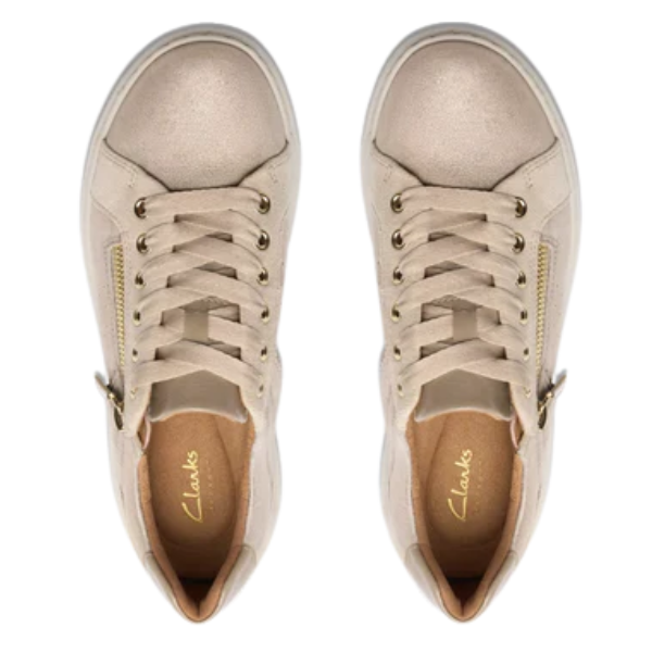 Top view of CLARKS Women's Nalle Zen Metallic sneakers with gold eyelets, side zippers, beige laces, and tan insoles featuring the CLARKS logo and Contour Cushion footbed for comfort.