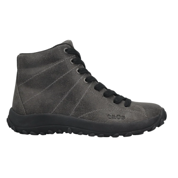 The Taos Women's Trail Mix Charcoal is a gray suede high-top sneaker with black laces, a black sole, subtle stitching details, and a supportive footbed. The TAOS brand name is embossed on the side.