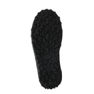 The black sole of the Taos Women's Trail Mix Black boot features a textured oval and circular grip pattern, viewed from below on a white background, with the TAOS brand logo at the center.