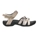 The TEVA Women's Tirra Black/Birch Multi sandal features adjustable ankle and toe straps, an open heel, a rugged black sole, and built-in arch support—ideal for outdoor or casual wear, shown on a white background.