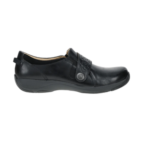 The DANSKO Women's Sallie Black is a black leather slip-on with a low heel, textured top strap, decorative silver button, rounded toe, and orthotic-friendly comfort—combining style and support for all-day wear.