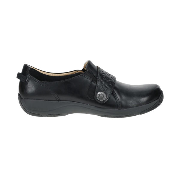 The DANSKO Women's Sallie Black is a black leather slip-on with a low heel, textured top strap, decorative silver button, rounded toe, and orthotic-friendly comfort—combining style and support for all-day wear.