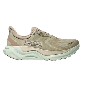 The HOKA Women's Arahi 8 Oyster Mushroom is a beige and light green stability running shoe with a thick cushioned sole for plantar fasciitis, mesh-like upper, and the HOKA logo on the side, shown in profile view.