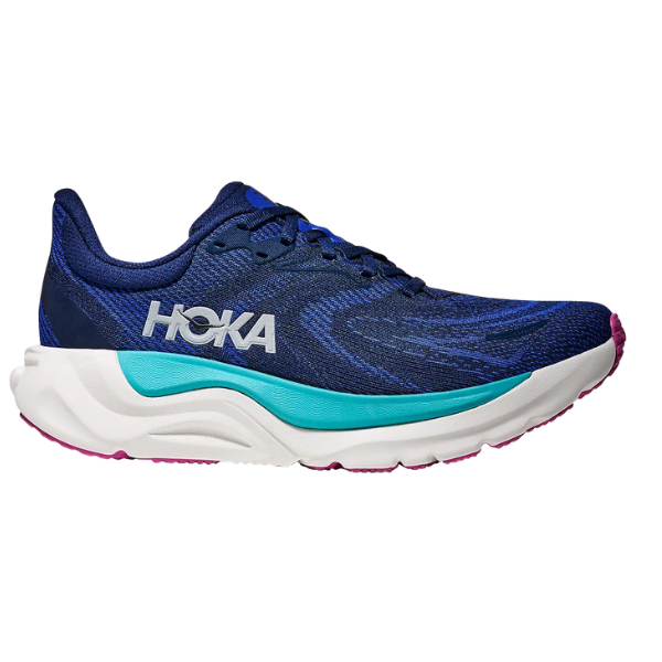 The HOKA Women's Arahi 8 Midnight Blue is a stability running shoe with a teal and white midsole, purple outsole, and white HOKA logo—shown from the left on a white background—offering ideal support for runners with plantar fasciitis.