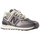 A New Balance Women's 574 sneaker in bronze/metallic with white laces and a cream sole, viewed from the side.