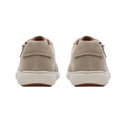 Rear view of HOKA Women's Transport 2 Wide Alabaster shoes with light beige uppers and white soles on white background.