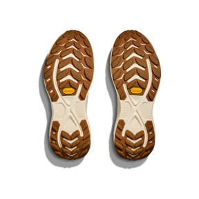 HOKA Women's Transport 2 Wide Alabaster shoes' treaded soles, viewed from above on a white background.