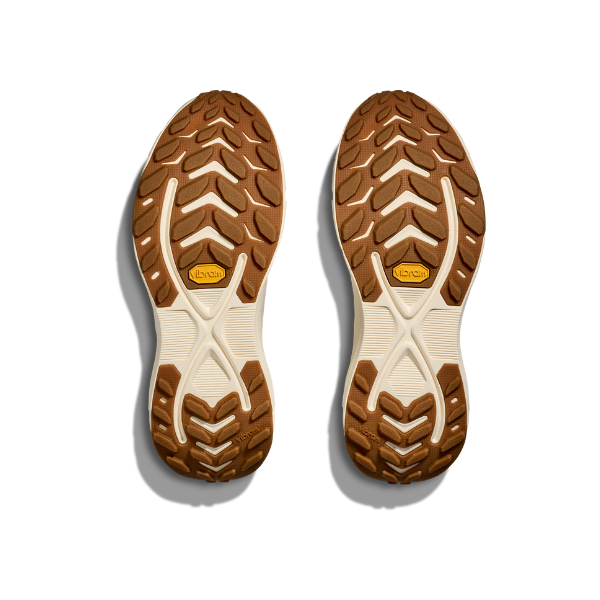 HOKA Women's Transport 2 Wide Alabaster shoes' treaded soles, viewed from above on a white background.