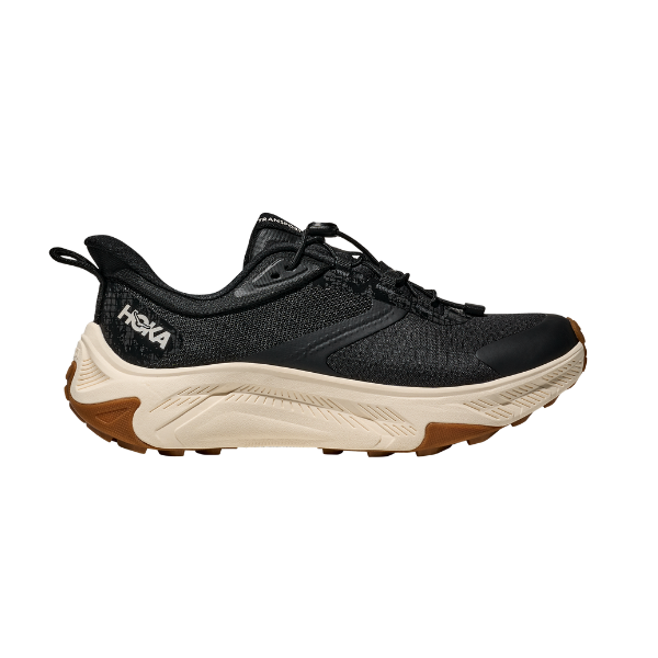 HOKA Women's Transport 2 Wide Black/White shoes shown from the side with a white sole and black upper on white.