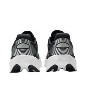 NEW BALANCE Men's Rebel v5 Black/White running shoes shown from the back on a white background.