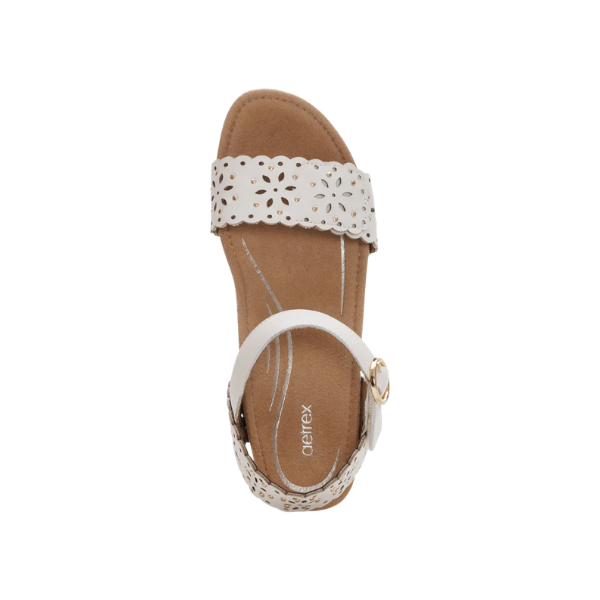 Top view of AETREX Women's Ashley Ivory Cutout—ivory sandal with floral cutouts and buckle strap.
